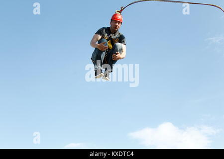 Belarus, Gomel, May 06, 2017.Jumping with a rope Extreme man jumping from a huge height. Engage in ropejumping Stock Photo