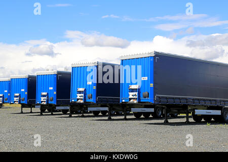 FORSSA, FINLAND - AUGUST 16, 2014: Row of trailers on a yard. The top 5 export destinations of Finland are Sweden, Germany, Russia, United States and  Stock Photo