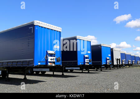 FORSSA, FINLAND - AUGUST 16, 2014: Row of trailers on a yard. The top 5 export destinations of Finland are  Sweden, Germany, Russia, United States and Stock Photo