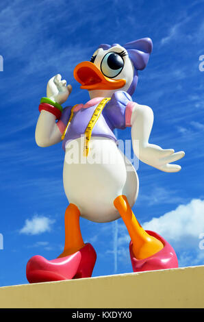 Monchique, Faro - Portugal, 30th, March 2013. Studio image of Daisy Duck figure Standing on a wall with a blue sky background. Stock Photo