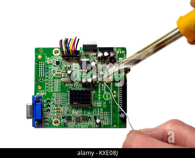 Soldering components on a circuit board Stock Photo