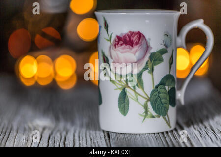 Tea cup on wood table in home with bokeh light background, Leisure lifestyle concept Stock Photo