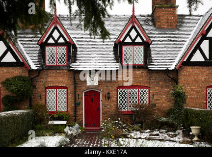 UK, England, Cheshire, Nantwich, Welsh Row, Sir Roger Wilbraham’s (Tollemache’s) Almshouses, garden and front door in snow Stock Photo