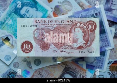 Bank of England 10 Shilling Banknote with the polymer bank notes in the background Stock Photo