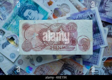 Bank of England 10 Shilling Banknote with the polymer bank notes in the background Stock Photo