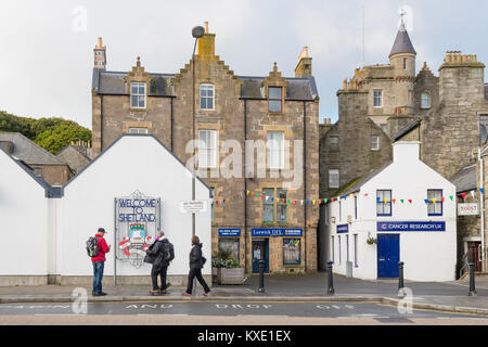 tourists photographing Welcome to Shetland sign in the town of Lerwick, Shetland Islands, Scotland, UK Stock Photo