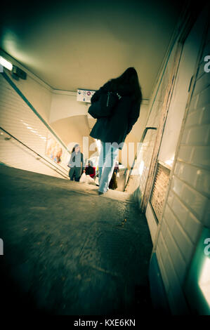 Woman walking in Parisian subway underpass Stock Photo