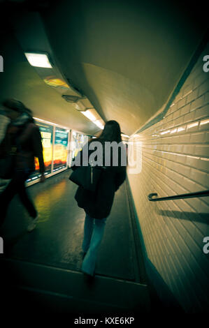 Woman walking in Parisian subway underpass Stock Photo