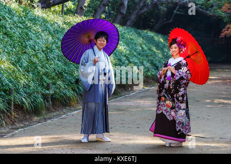 OKAYAMA, JAPAN - NOVEMBER 17: Japanese Couple in Okayama, Japan on November 17, 2013. Unidentified groom and bride dress traditional costume for their Stock Photo