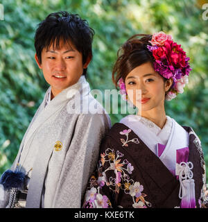 OKAYAMA, JAPAN - NOVEMBER 17: Japanese Couple in Okayama, Japan on November 17, 2013. Unidentified groom and bride dress traditional costume for their Stock Photo