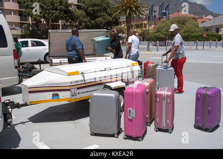 Cape Town South Africa. December 2017, Holidaymakers luggage being loaded for transportation to the next destination Stock Photo