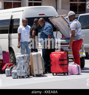 Cape Town South Africa. December 2017, Holidaymakers luggage being loaded for transportation to the next destination Stock Photo