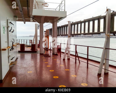 The deck of a cargo ship. Red floor and white walls Stock Photo