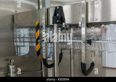 Plastic transparent bottles move on the conveyor.Plastic bottles on the conveyor Stock Photo