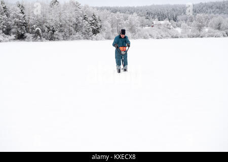 Ice fishing in Sweden Stock Photo