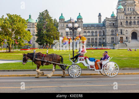 Horse-drawn carriage in Victoria known as the Garden City on Vancouver Island in British Columbia, Canada Stock Photo