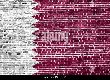 Flag of Qatar painted on brick wall, background texture Stock Photo