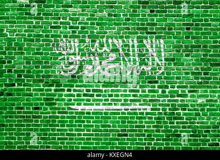 Flag of Saudi Arabia painted on brick wall, background texture Stock Photo