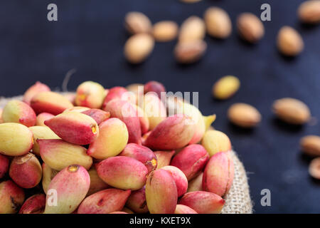 Fresh pistachios in shell in a sack Stock Photo