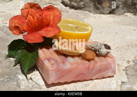 Handmade soap, lemon, almond and flower Stock Photo