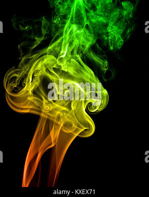 A streams of colored smoke on black background Stock Photo