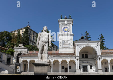 Piazza della Libertà square with clock tower, statue of Cacus and Loggia di San Giovanni - Udine, Friuli Venezia Giulia, Italy Stock Photo