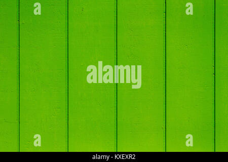 Bright lime green wooden background texture of parallel vertical timber planks or boards in a full frame view Stock Photo