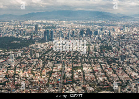 Aerial view showing the haze of pollution over the skyscrapers along Paseo de la Reforma October 25, 2017 in downtown Mexico City, Mexico. Mexico City is the capital of Mexico and and the most populous city North America. Stock Photo