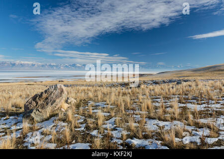 A view of the snow-covered Wasatch Mountains from Antelope Island State Park in winter. Stock Photo