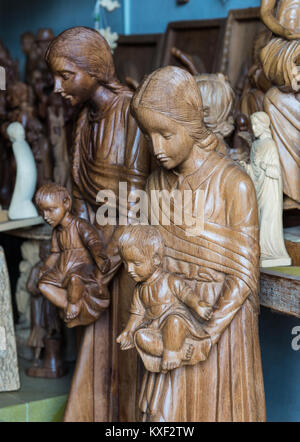 Wood carvings of Mother Maria and baby Jesus in a local souvenir store. Madagascar, Africa. Stock Photo