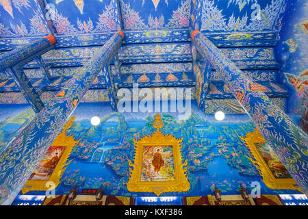 CHIANG RAI, THAILAND - December 20, 2017: Very beautiful buddhist mural painting in the chapel of Wat Rong Sua Ten or Rong Sua Ten temple. This place  Stock Photo