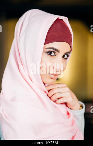 Portrait of a beautiful Muslim woman in cafe Stock Photo
