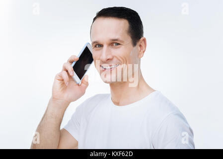 Joyful nice man looking at you Stock Photo