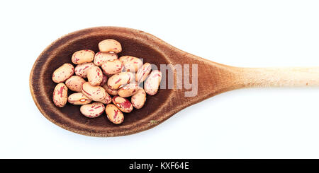 Raw pinto beans in a wooden spoon on white background Stock Photo