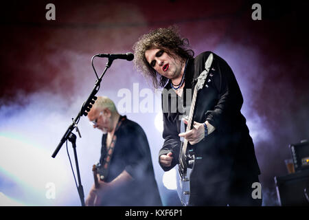 Lead singer Robert Smith wears his traditional make up at a live concert with the English band The Cure who performed at the Orange Stage at the Danish festival Roskilde Festival 2012. Denmark 05.07 2013. Stock Photo