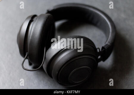 Black headphones gaming headphones on dark background Stock Photo
