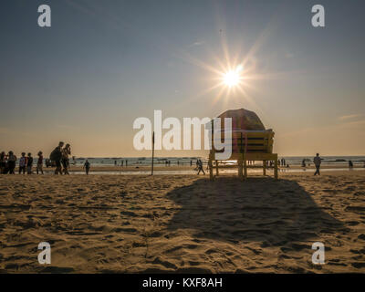 Goa, India - December, 21 2017 : Beach bed with umbrella with sun flares at North Goa beach called Baga Beach Stock Photo