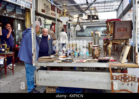 Back of lorry used as display in flea market with bric-a-brac end of Ermou street by Monstiraki Metro station , Athens, Greece Stock Photo