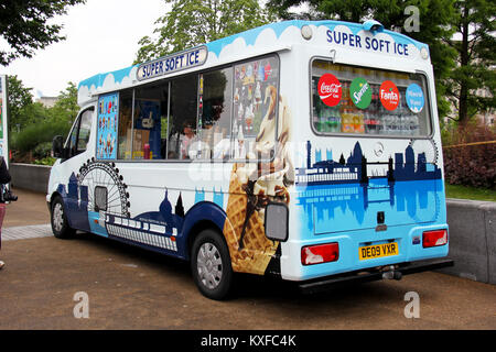 England, Kent, Orpington – Circa July 2014: Ice cream seller parked in his ice cream van waiting to serve clients. Stock Photo