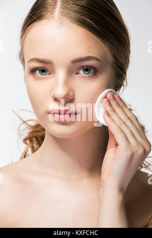 Close-up of young woman holding beauty sponge Stock Photo