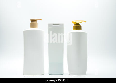 Set of shampoo and hair conditioner plastic bottle with golden pump isolated on white background with blank label and copy space Stock Photo