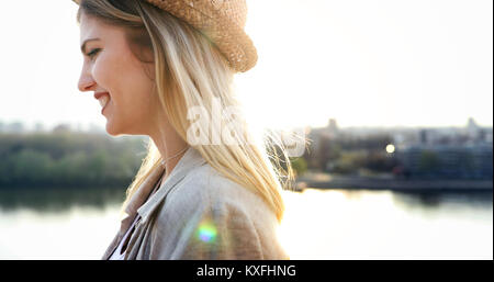 Happy blond female wearing hat outdoor Stock Photo