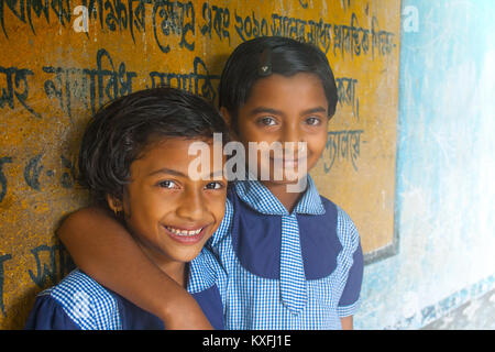 Portrait of two elementary school girls smiling in library Stock Photo ...