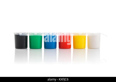 Large set of gouache paint cans in a row. Colorful paints isolated on white. Stock Photo