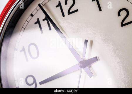 Red wall clock isolated on white background Stock Photo
