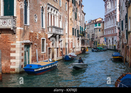 A canal view with boats in Veneto, Venice, Italy, Europe. Stock Photo