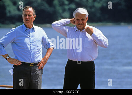 Severn River, Maryland, USA. 17th June, 1992. President Boris Yeltsin of the Russian Federation, right, adjusts his collar after removing his tie as he and United States President George H.W. Bush, left, take a boat ride on the Severn River in Maryland on June 17, 1992. Credit: Ron Sachs/CNP Credit: Dennis Brack/CNP/ZUMA Wire/Alamy Live News Stock Photo