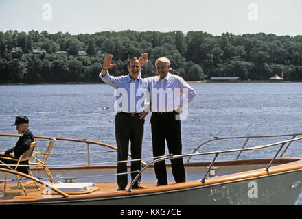 Severn River, Maryland, USA. 17th June, 1992. United States President George H.W. Bush, left, and President Boris Yeltsin of the Russian Federation, right, wave to the photographers as they take a boat ride on the Severn River in Maryland on June 17, 1992. Credit: Ron Sachs/CNP Credit: Dennis Brack/CNP/ZUMA Wire/Alamy Live News Stock Photo