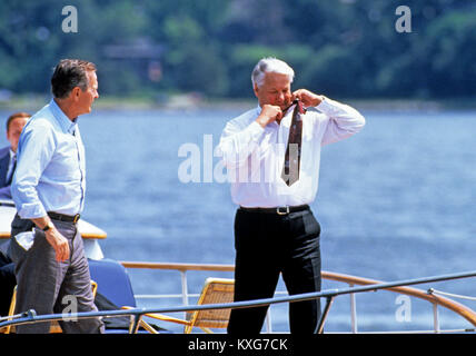 Severn River, Maryland, USA. 17th June, 1992. President Boris Yeltsin of the Russian Federation, right, removes his tie as he and United States President George H.W. Bush, left, take a boat ride on the Severn River in Maryland on June 17, 1992. Credit: Ron Sachs/CNP Credit: Dennis Brack/CNP/ZUMA Wire/Alamy Live News Stock Photo