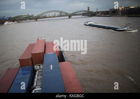 Cologne, Germany. 10th Jan, 2018. Ships sailing on the river Rhine in Cologne, Germany, 10 January 2018. The Rhine has been cleared for navigation once again after the rise in its waters' level. Credit: Rolf Vennenbernd/dpa/Alamy Live News Stock Photo